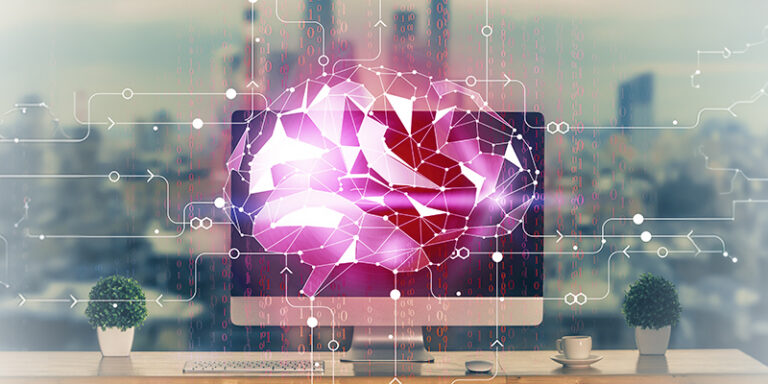 Pink geometric AI brain displayed on a computer monitor, with circuit lines over a desk setup.