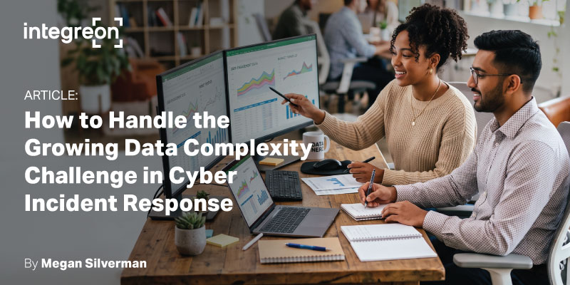 Two coworkers review charts on desktop screens in a modern office, illustrating an article about handling growing data complexity in cyber incident response.